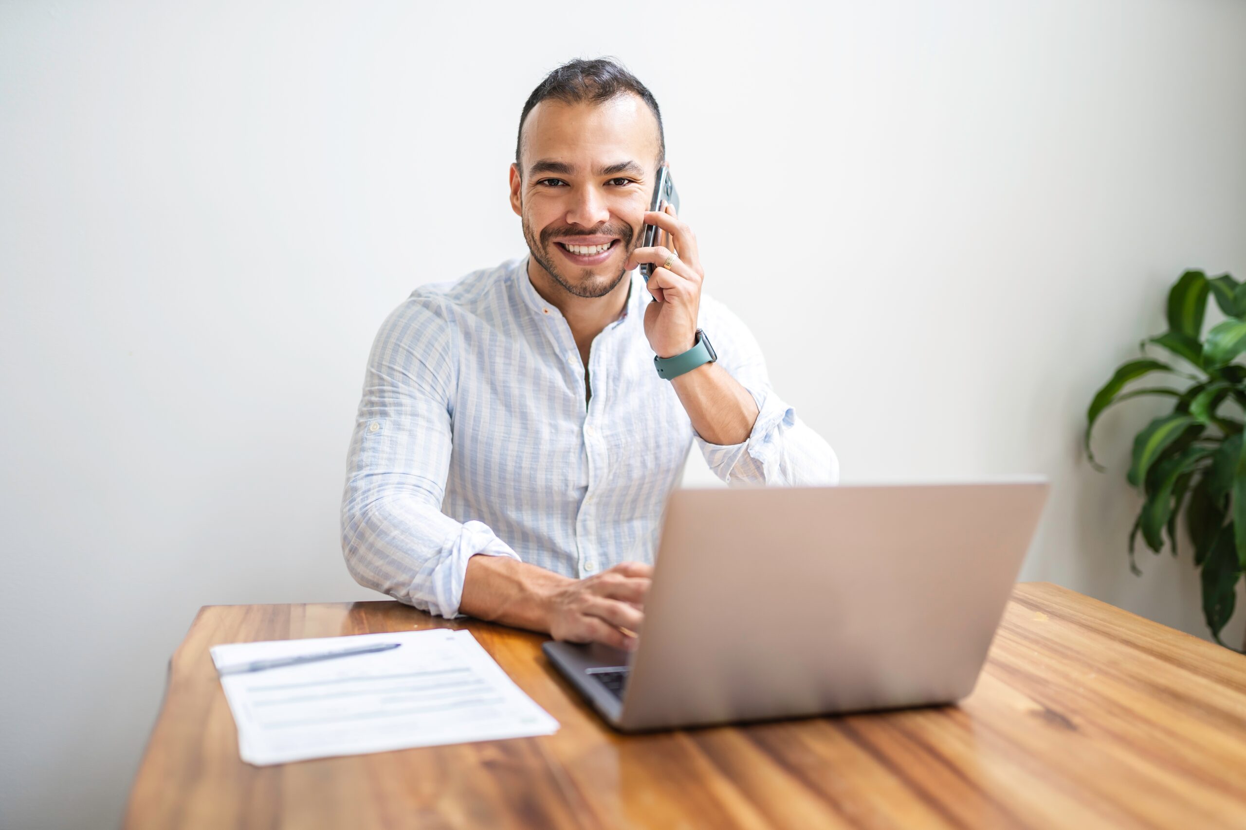A,Corporate,Portrait,Young,Mexican,Attractive,Businessman,Working,At,Modern